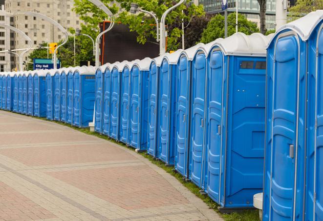 hygienic portable restrooms lined up at a beach party, ensuring guests have access to the necessary facilities while enjoying the sun and sand in Federal Way, WA